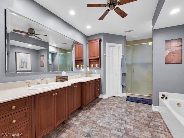 bathroom featuring separate shower and tub, ceiling fan, and vanity