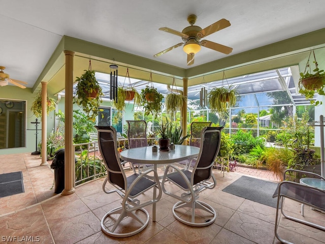 sunroom featuring ceiling fan