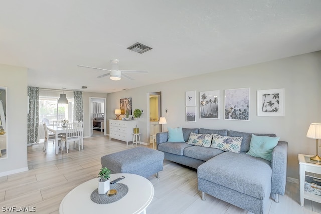 living room featuring ceiling fan