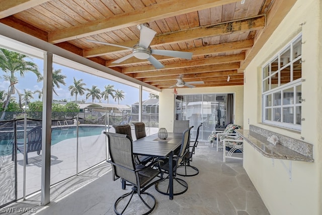 exterior space featuring beam ceiling, wood ceiling, and ceiling fan