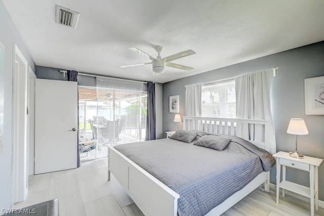 bedroom featuring light tile patterned flooring, access to exterior, and ceiling fan