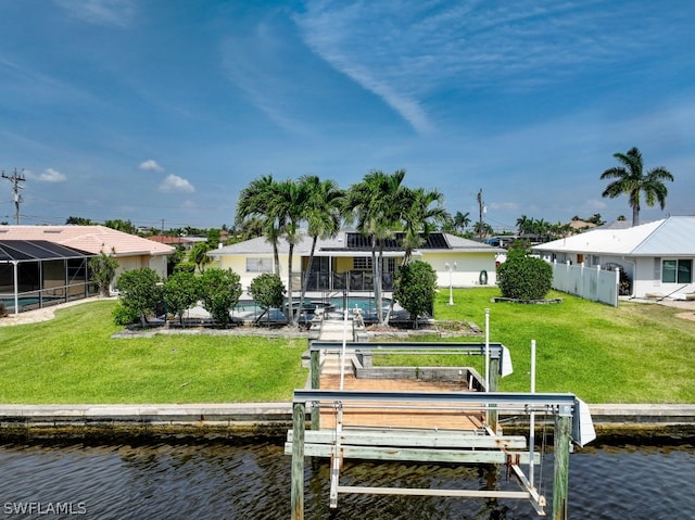 view of dock with a water view, a yard, and a lanai