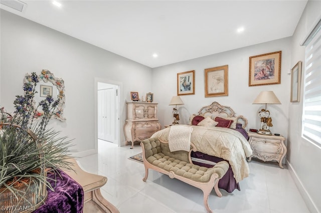 tiled bedroom with multiple windows