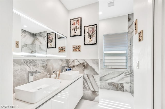 bathroom featuring tile walls, tile flooring, and double sink vanity