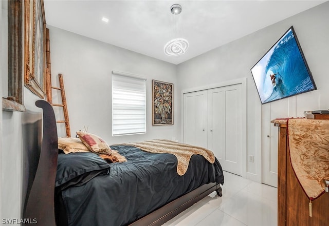 tiled bedroom featuring a closet