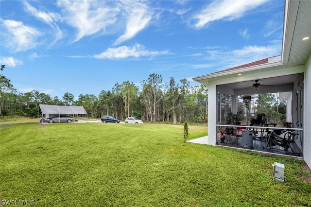 view of yard with ceiling fan