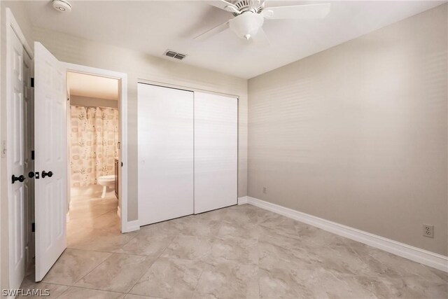 unfurnished bedroom with a closet, ceiling fan, and light tile floors