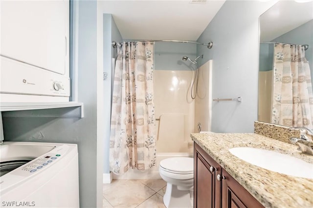 full bathroom featuring oversized vanity, toilet, tile floors, stacked washer / dryer, and shower / bath combo