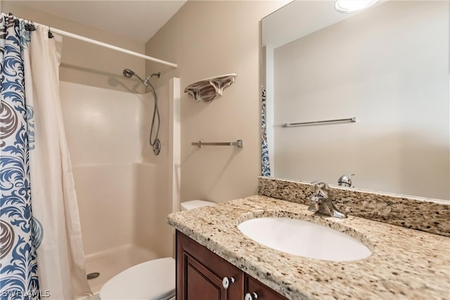 bathroom with vanity, toilet, and a shower with shower curtain