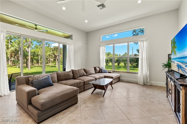 tiled living room with ceiling fan