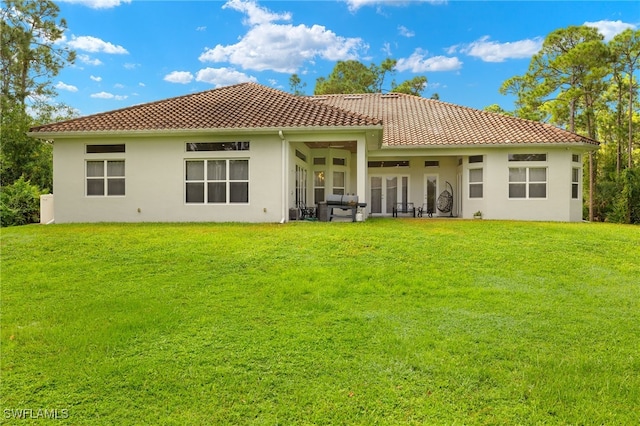 back of house with a yard