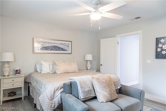 bedroom featuring ceiling fan and dark hardwood / wood-style floors