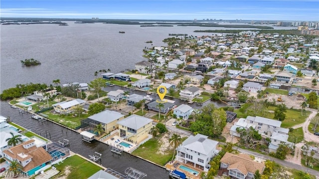 bird's eye view featuring a residential view and a water view