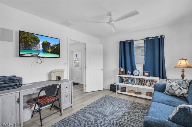 home office featuring ceiling fan and light hardwood / wood-style floors