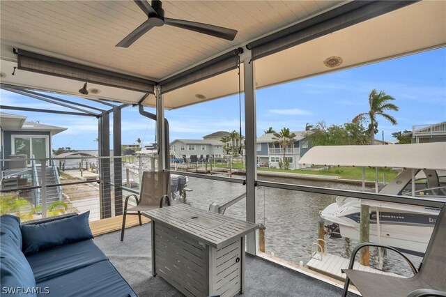 wooden deck featuring outdoor lounge area and ceiling fan