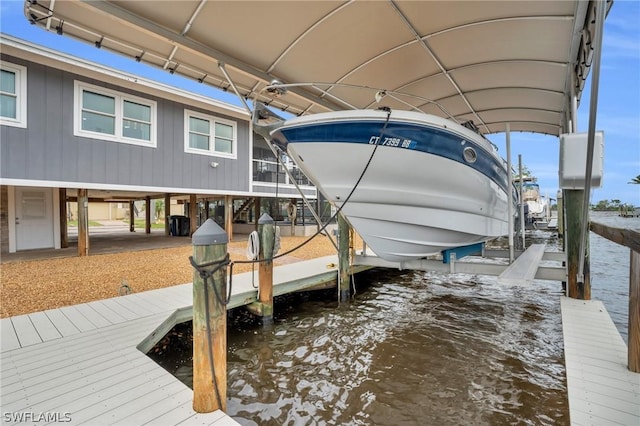 view of dock featuring a water view and boat lift