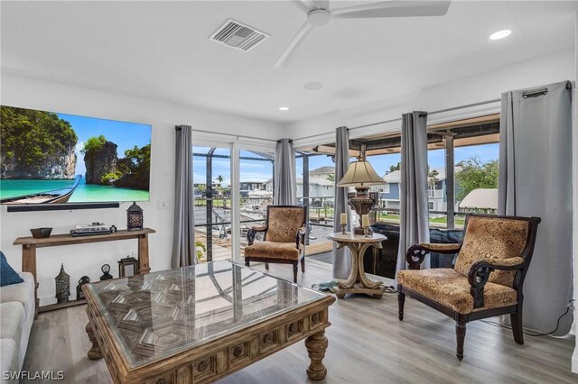 sunroom featuring ceiling fan