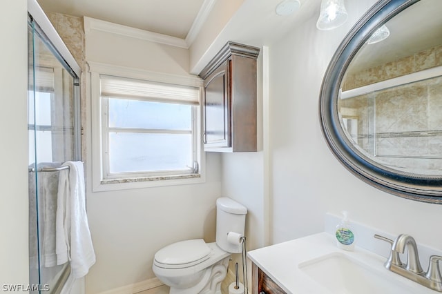 bathroom featuring vanity, toilet, and crown molding