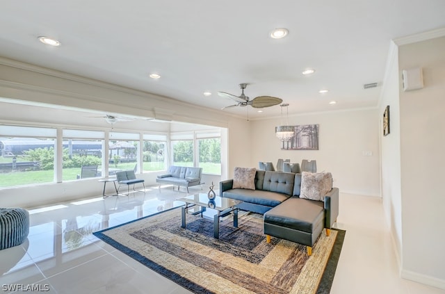 living room with crown molding, ceiling fan, and tile patterned floors