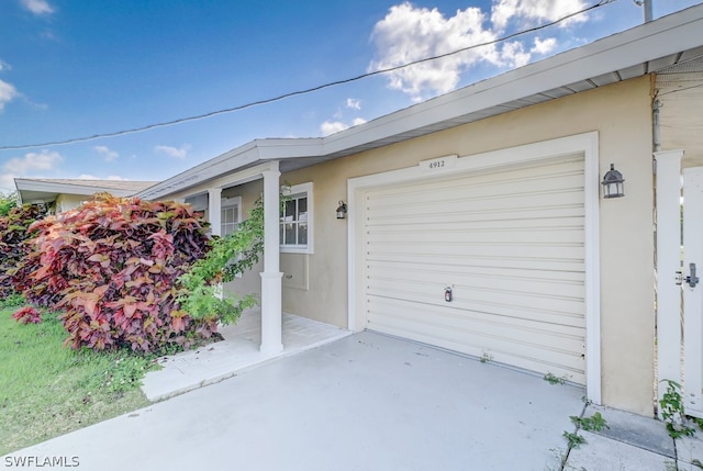 view of exterior entry featuring a garage