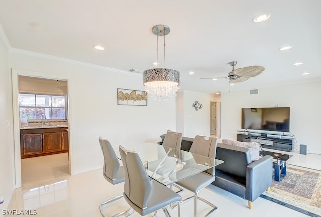 dining space featuring ceiling fan with notable chandelier, light tile patterned floors, and crown molding