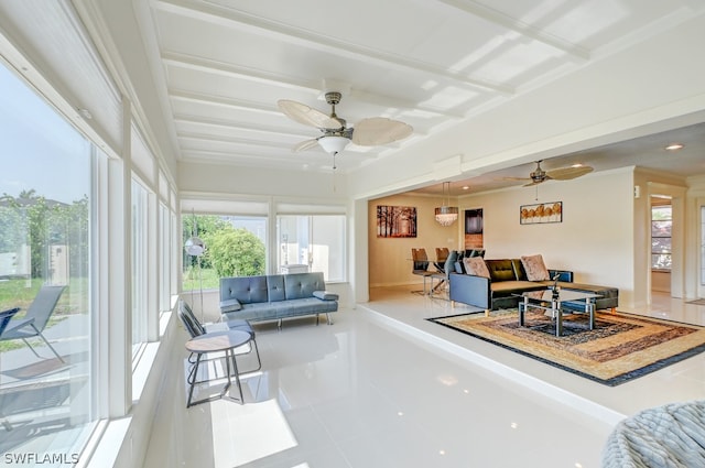 interior space with tile patterned floors, crown molding, and ceiling fan