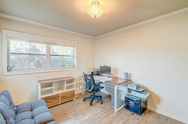 office with ornamental molding, a wealth of natural light, and light wood-type flooring