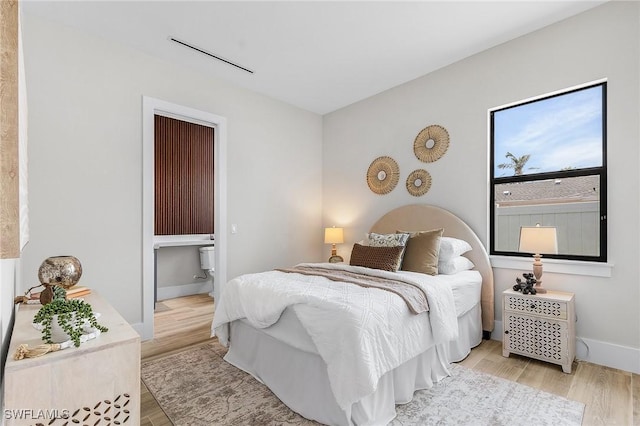689 101st Ave N, Naples, FL 34108 - bedroom featuring light wood-style flooring and baseboards