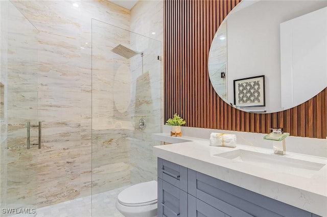 689 101st Ave N, Naples, FL 34108 - full bath with vanity, tiled shower, and toilet