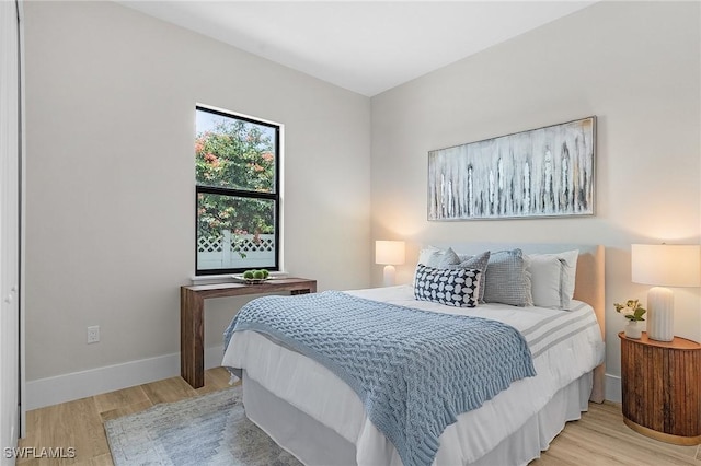 689 101st Ave N, Naples, FL 34108 - bedroom featuring light wood-style flooring and baseboards