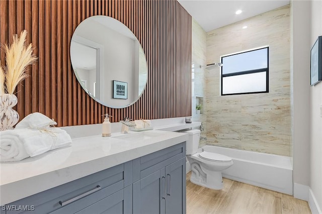 689 101st Ave N, Naples, FL 34108 - bathroom with vanity, toilet, washtub / shower combination, and recessed lighting