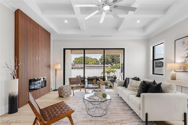 689 101st Ave N, Naples, FL 34108 - living area with coffered ceiling, light wood-style flooring, plenty of natural light, a ceiling fan, and beamed ceiling