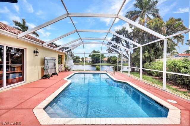 view of pool with a lanai and a patio