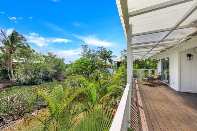 wooden deck with an outdoor living space