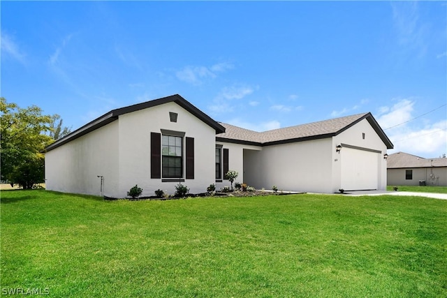 single story home featuring a garage and a front lawn