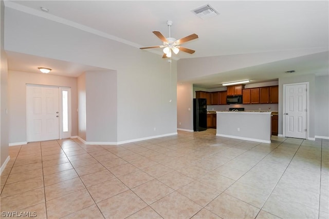 unfurnished living room featuring light tile patterned floors, ceiling fan, and lofted ceiling