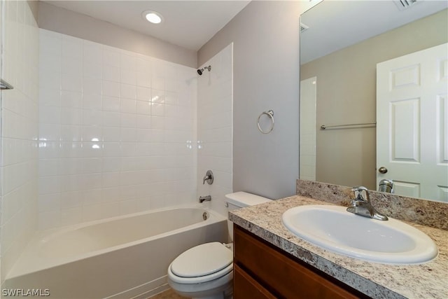 full bathroom featuring shower / bathing tub combination, vanity, and toilet