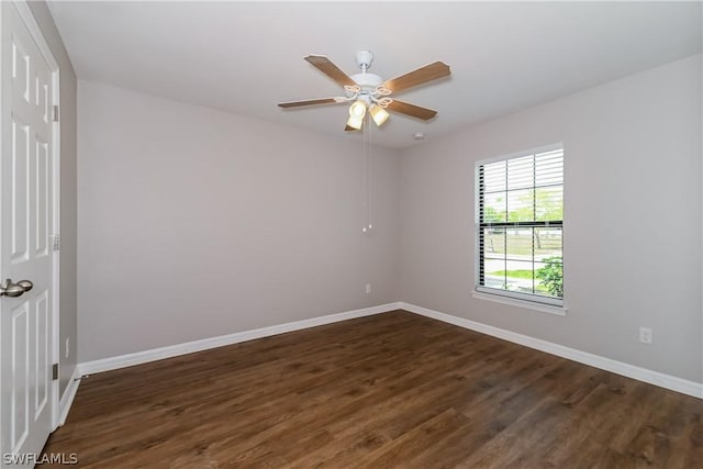 spare room featuring ceiling fan and dark hardwood / wood-style flooring