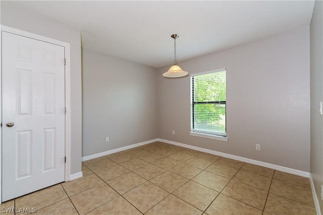 empty room with light tile patterned flooring