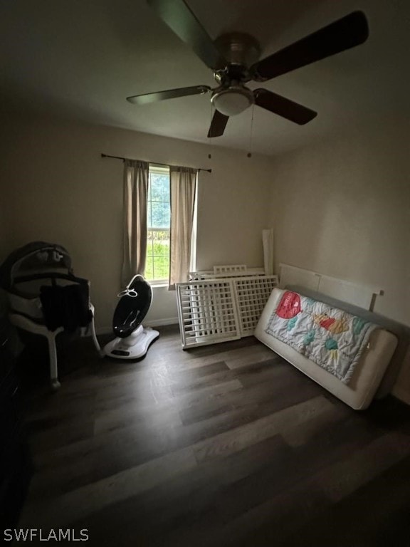 bedroom with hardwood / wood-style flooring and ceiling fan