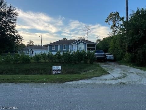 4015 16th Ave SE, Naples, FL 34117 - view of front facade featuring concrete driveway