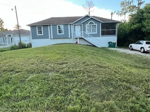 view of front facade with a front lawn