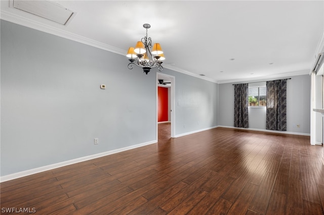 unfurnished room featuring crown molding, dark wood-type flooring, and a notable chandelier