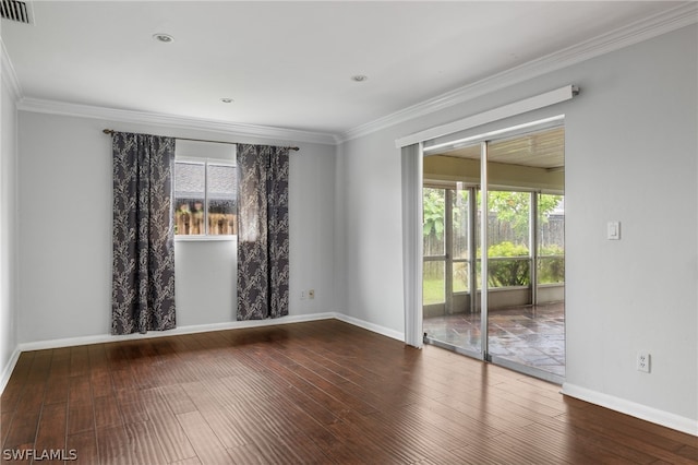 unfurnished room featuring ornamental molding and dark hardwood / wood-style flooring