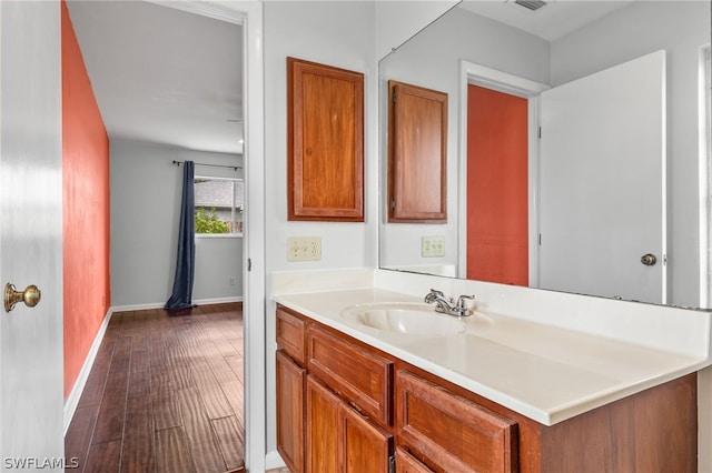 bathroom featuring vanity and wood-type flooring