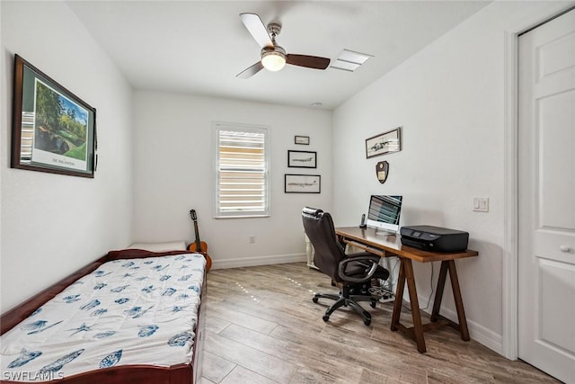 bedroom featuring ceiling fan and light hardwood / wood-style flooring