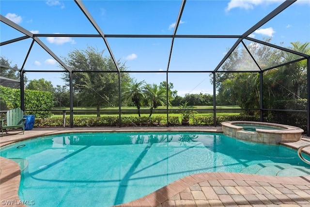 view of pool with a patio, glass enclosure, and an in ground hot tub