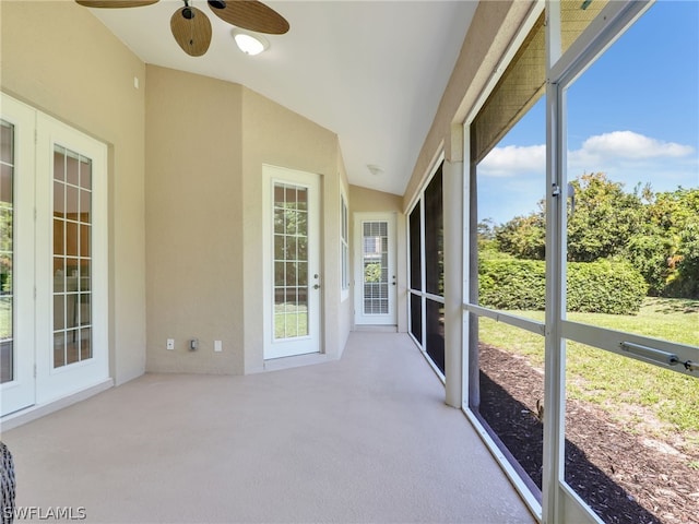 sunroom / solarium with ceiling fan and lofted ceiling