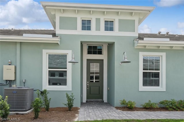 doorway to property with central air condition unit