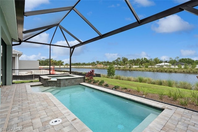 view of pool with glass enclosure, an in ground hot tub, a water view, and a patio